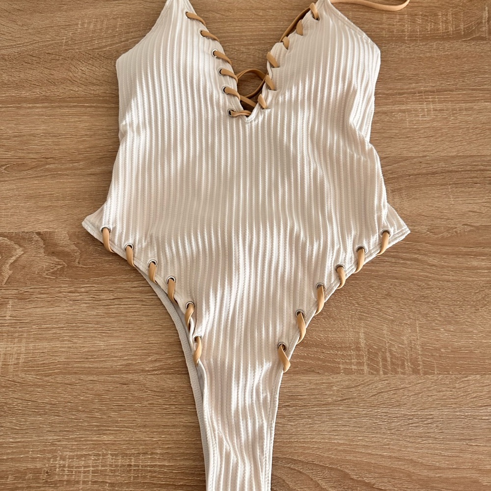 Sexy Cream One Piece Swimsuit with Ribbed Texture and Lace-Up V-Neck